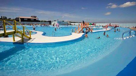 An outdoor swimming pool on a sunny day