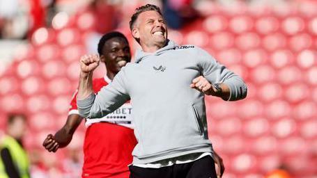 Rob Edwards celebrates at full-time