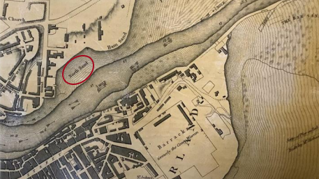 An old black and white map that shows the River Wear and surrounding land. North Sand is to the left of the river and highlighted by a red circle.