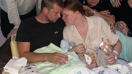 Baby Theo with his parents