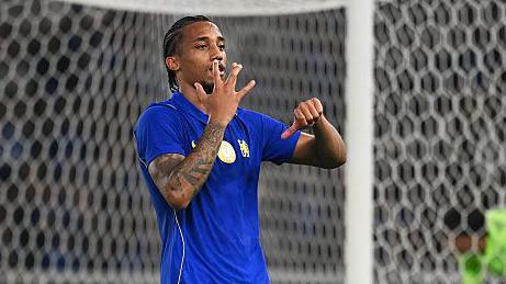 Chelsea forward Joao Pedro celebrates scoring against AC Milan