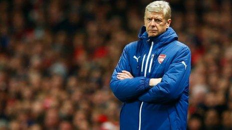 Arsene Wenger looks on