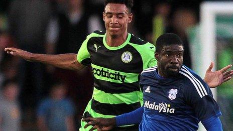 Bruno Ecuele Manga (R) of Cardiff City pushes forward against Forest Green Rovers