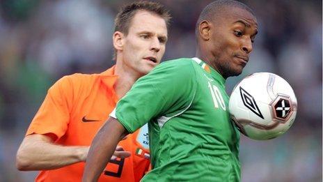 Andre Ooijer of the Netherlands puts pressure on Republic striker Clinton Morrison in the 2006 friendly in Dublin