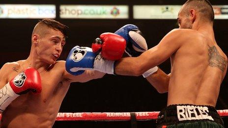 Ryan Burnett (left) throws a punch against Robert Kanalas