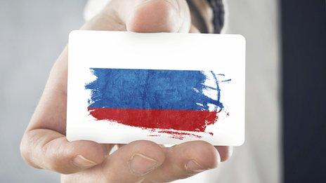 A membership card featuring a Russian flag