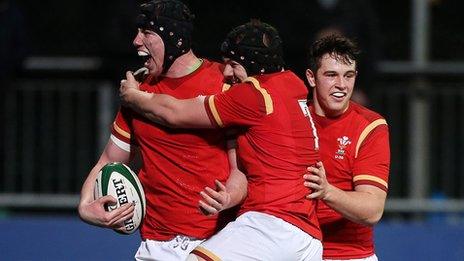 Adam Beard celebrates after scoring Wales' second try