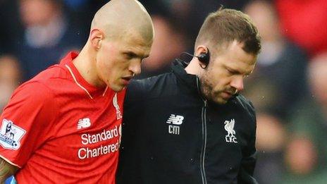 Martin Skrtel is helped off the pitch