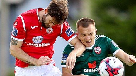 Goalscorer Rory Hale beats Sligo's Kyle Callan to the ball
