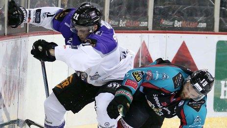 Belfast Giants' Colin Shields tussles with Coventry's Zach Sullivan in their Elite League clash at the SSE Arena