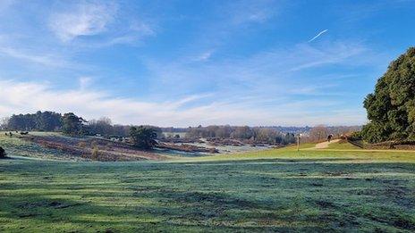 Blue sky over a rolling green field in Woodbridge, Suffolk