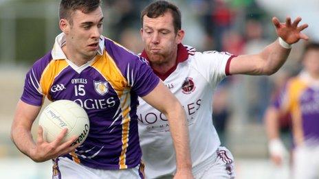 Derrygonnelly forward Connall Jones is closed down by Slaughtneil's Patsy Bradley