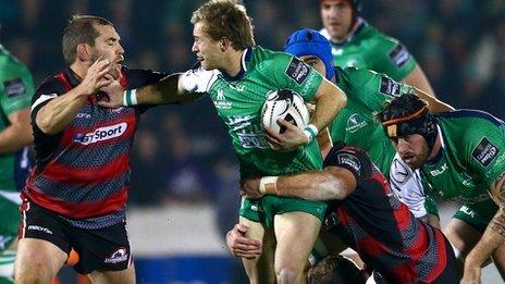 Edinburgh pair Neil Cochrane and Roddy Grant tackle Connacht's Kieran Marmion