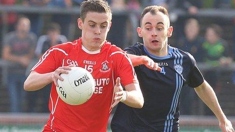 Trillick's Daire Gallagher is challenged by Gabhan Sludden in the Tyrone final