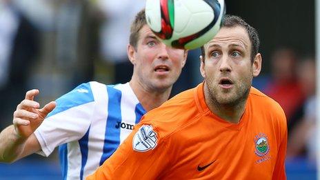 Coleraine's Steven Douglas challenges Blues forward Guy Bates