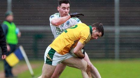 Fermanagh's Barry Mulrone tackles Kerry opponent Donal Keogan