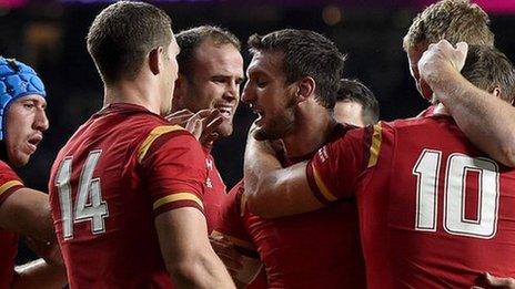 Captain Sam Warburton congratulates his players after Wales beat England