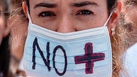 Doctors and other health workers chant slogans during a demonstration against the shortage in medicines and in rejection of the government of President Nicolas Maduro, in Caracas on May , 17, 2017.