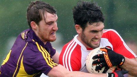 Wexford's Rob Tierney challenges Danny Heavron at Owenbeg