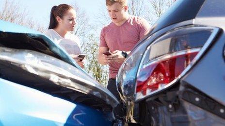 People exchanging details after a car crash