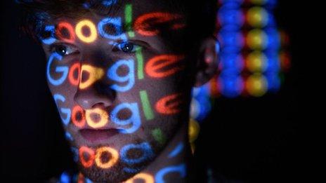 man with google logo projected onto face