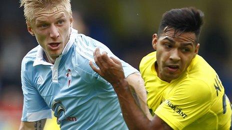 Celta Vigo and Villarreal players battle for the ball