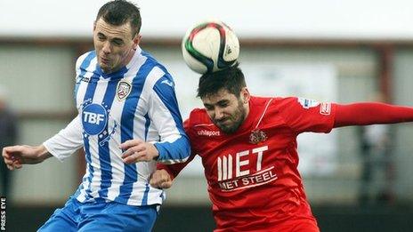 Coleraine's Darren McCauley challenges Portadown midfielder Sean Mackle