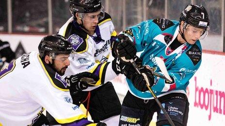 Two Manchester Storm players challenge Giants opponent Mark Garside