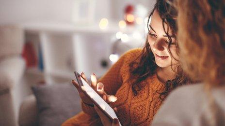 women using a tablet