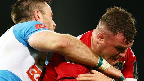 Abraham Jurgens of Benetton Treviso tackles Munster's Dave Kilcoyne