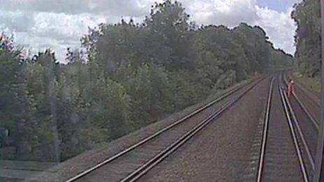 The track worker on the line as pictured by the CCTV camera on the train