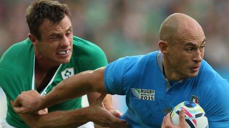 Ireland winger Tommy Bowe challenges Italy’s Sergio Parisse