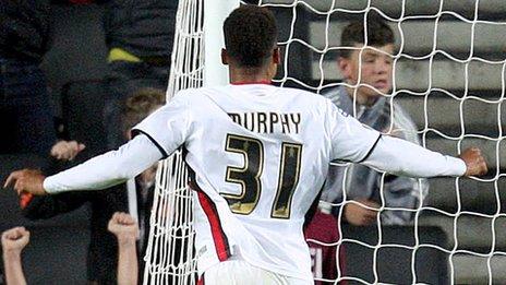 Josh Murphy of MK Dons slots home the winning extra-time goal