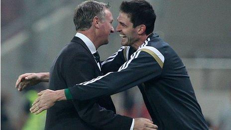 Michael O'Neill embraces Kyle Lafferty