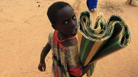 A girl arrives at a refugee camp in Kenya