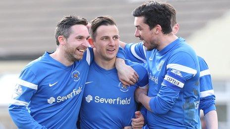 Ballinamallard players congratulate goalscorer Shane McCabe