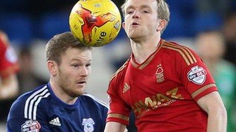 Aron Gunnarsson battles for the ball with Nottingham Forest's Jonny Williams