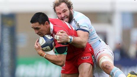 Regan King of Scarlets is tackled by Antonie Claassen of Racing 92