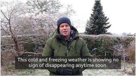 Simon King stands in front of a snowy and frosty background