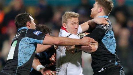 Ulster fullback Stuart Olding is tackled by two Glasgow players during Frday's Pro12 match at Kingspan Stadium