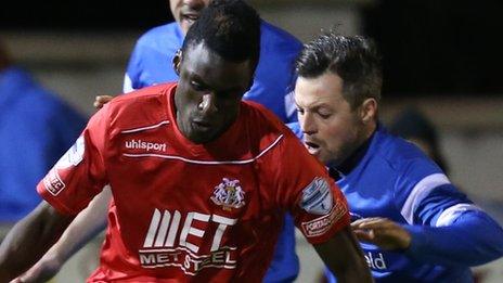 Portadown's Marcio Soares tussles for possession with Ivan Sproule of Ballinamallard