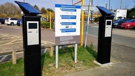 Photograph of the touch screens which passengers can use to buy tickets.