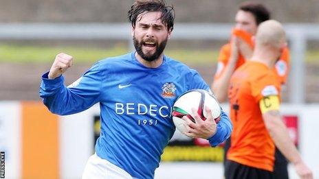 Glenavon player/manager Gary Hamilton celebrates his late equaliser at Carrick