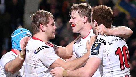 Chris Henry and Paddy Jackson congratulate Ulster try-scorer Andrew Trimble