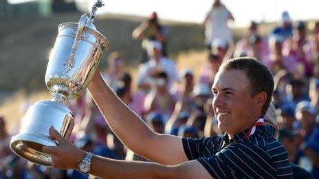 Jordan Spieth holds up his trophy