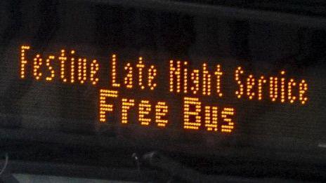 Bus sign saying 'Festive Late Night Service Free Bus'