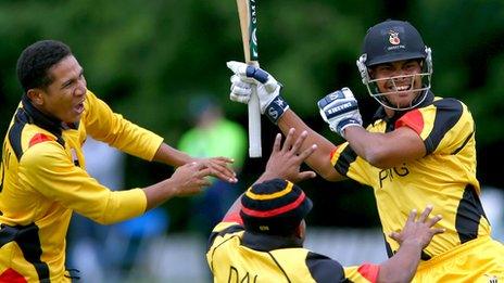 PHG players rush to congratulate Norman Vanue are his batting heroics