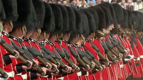 Soldiers marching with heads turned to left