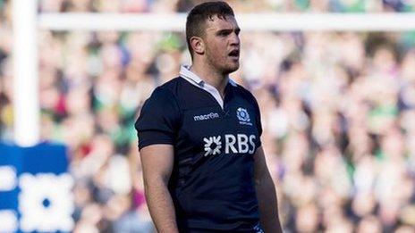 Adam Ashe in action for Scotland