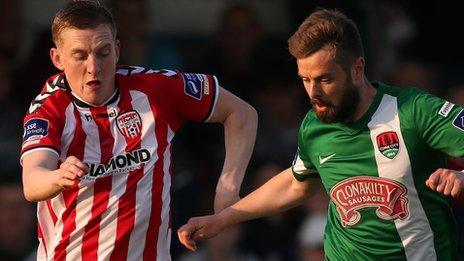 Derry City's Ronan Curtis tussles for possession with Cork City midfielder Greg Bolger